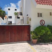 Enter through this gate. It is in the back at The Beached Bikini in Akumal