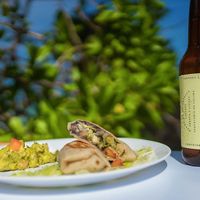 This is a burrito it comes with guacamole   at The Beached Bikini in Akumal