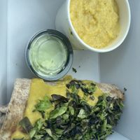 Breakfast burrito with a side of Southern style grits  at Sluggo's North Vegetarian Cafe in Chattanooga