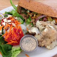 Philly cheese steak with mashed potatoes and fresh salad at Sluggo's North Vegetarian Cafe in Chattanooga
