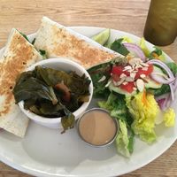 Hummus wrap plate with salad and collards  at Sluggo's North Vegetarian Cafe in Chattanooga