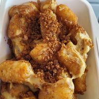 Tater tots with cheese and bacon at PMA Foods in Syracuse