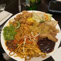 plate of hot food - ‘beef’, yellow ‘chicken’ curry, sweet + sour ‘chicken’, ‘chicken’ in black bean sauce, mixed veg noodles, special fried rice, mixed veg, crispy  at Su Vegan Buffet in West London
