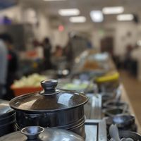 Long, long line of vegan dishes with a lovely depth of field so you can't see any of them! at Su Vegan Buffet in West London