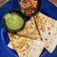 Choridilla - Plant-based chorizo and plant-based cheddar in a flour tortilla with sides of pico de Gallo and guacamole. at ROOST in York