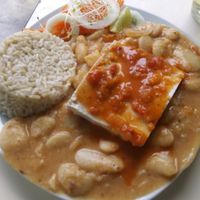 Brown rice, tofu with tomato sauce and pallares (big lima beans) at Casa Vegetariana Luz y Salud in Lima