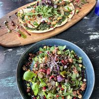 Flammkuchen and toast avocado with salad  at Vegane Glorie in The Hague