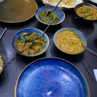 [from left-to-right] Pilau rice, baigen aloo, tarka dahl & lahori chanay x2  - all vegan & gf! (saag aloo in top middle is vegetarian only)  at Roti of Edinburgh in Edinburgh