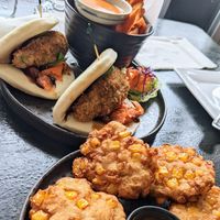 Avocado bao buns and corn fritters at I'm Vegan in Chicago