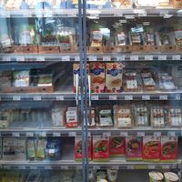 Cooled section with of tofu, vegan cheese, and vegan fish and meat products. Big range of e.g. Wheaty faux meats. at Birkenfelder Biomarkt in Birkenfeld