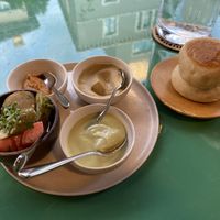 Pillow bread with vegan Mayo, hummus, red tomato pesto, and spiced pickles.  at KLE in Zurich