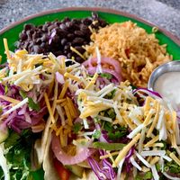 There are three tacos under there! 😍 Vegan squash tacos on the yellow corn tortillas, with pickles onion/cilantro/vegan cheese shreds.  Also featuring the homemade vegan crema!  at Migrants in Madison