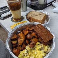 The alchemist with extra vegan sausage and I added mushroom and onion. Oat milk in the coffee at Toast Coffeehouse in Patchogue