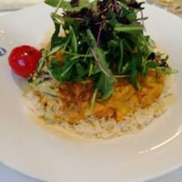 Thai lentil curry with vegetables, coco cream, rucola and rice at Reichsküchenmeister Restaurant in Rothenburg Ob Der Tauber