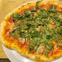 Pizza with rucola mushroom and vegan mozzarella at Pizzeria Agordina in Agordo