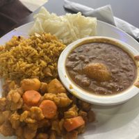 Chikn entree with rice, beans, and yuccaa  at The Earthy Kitchen in Orlando