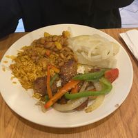 Yuca, yellow rice with read beans. “Pepper steak”  at The Earthy Kitchen in Orlando