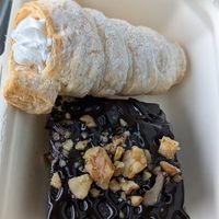 Brownie with walnuts and cream roll. at Loving Hut - Na Porici in Prague