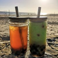 Left: peach green tea with PATEA pearls Right: green apple blizzard with PATEA pearls (in byo cups with byo straws)  at PATEA in Glenelg