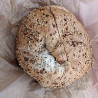 Everything bagel,toasted, with tofu, spinach, and artichoke spread at Liberty Bagels in New York City