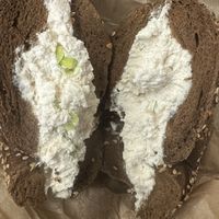 Tofu scallion on pumpernickel everything   at Liberty Bagels in New York City