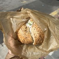 Vegan toasted garlic bagel with tofu scallion cream cheese at Liberty Bagels in New York City