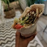Falafel za'atar pita wrap (with tahini, mint, parsley, cucumber, tomatoes, and more). Soooo good at Santo Falafel in Florence