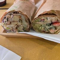 Primavera and Baked Falafel Wraps cut in half. at Santo Falafel in Florence