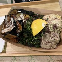 Eggplant plate with tabouleh, avocado hummus, hummus and babaganosh    at Santo Falafel in Florence