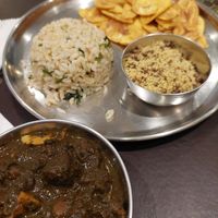 Maniçoba with soy farofa, jambu rice and plantain chips (77 BRL with little side salad and juice) at Govinda Vegetariano - Batista Campos in Belem