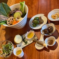 The large bowl is ramen, but it is full of vegetables and hides the noodles and soup! at Veganic Monkey Magic 浅草 in Tokyo