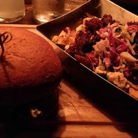 Burger Sin Carne and side of poutine at Le Trèfle in Montreal