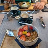 Acai bowl + bowl with kiwi and passionfruit + croissant at Kaffee Kamiel in Bruges