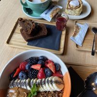 Acai bowl with peanut butter. Banana bread and cinnamon roll, both vegan.   at Kaffee Kamiel in Bruges