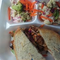 Vegan rueben seitan sandwich with coleslaw and potato salad at Chef Brooke's Natural Cafe in Fort Myers