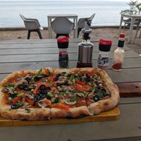 Veggie pizza without cheese at La Casa Tropicana by Cospace in Koh Phangan