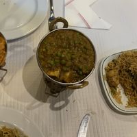 Sorry, we couldn’t wait, left chicken masala, middle curry, right friend rice, bread isn’t included in the picture  at New Himalaia in Lisbon