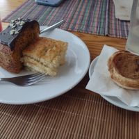 Carrot cake, a yoghurt dessert, and a vegan nata - all super yummy! at Granos Espaço Vegetariano in Lisbon