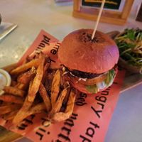 'Pink bombshell burger' with salad, sweet potato fries, and vegan mayo. at The Hungry Tapir in Kuala Lumpur