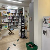 Books and fridge with vegan foods, like Watson’s cheese  at VEGA-LIFE in Amsterdam