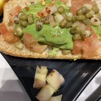 White tomato pieces that shouldn’t have been in the avocado toast   at Copper Branch - Argentia Rd in Mississauga