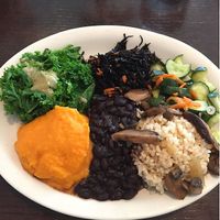 This is the macrobiotic plate with cucumber salad, brown rice, shiitake mushrooms, black beans, sweet potato purée, steamed kale, and seaweed plus a cup of miso soup. Yummy! at Blind Faith Cafe in Evanston