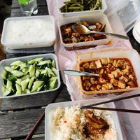 Green beans on top, eggplant in the middle and mapo tofu at the bottom. Cucumbers with garlic on the left. at Mei Lin in Helsinki