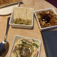 Cashew cheese, muhumarra, and hummus with pita   at Lulu Green in Boston
