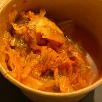 Side pot of kimchi  at Wulf & Lamb Marylebone in London
