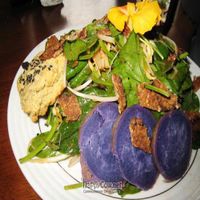 Korean spinach salad with tempeh bacon bits and purple sweet potatoes at Nasturtium Cafe in Kealakekua
