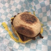 Breakfast sandwich on an english muffin with vegan bacon, egg, cheese, and mayo! Other available options included adding sausage on a croissant with spicy mayo  at Brewing Good Coffee Company in Savage