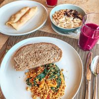 Vegan crepes, scrambled tofu with homemade sourdough bread, and smoothie bowl at Suma Restaurant in Gerokgak