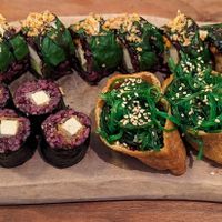 The Green Miso (back), miso glazed tofu maki (front left), seaweed inari (front right) at Vegan Sushi Bar - Kinkerstraat in Amsterdam