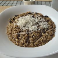 Vegan mushroom risotto with vegan cheese at samsara restaurant in Buzios